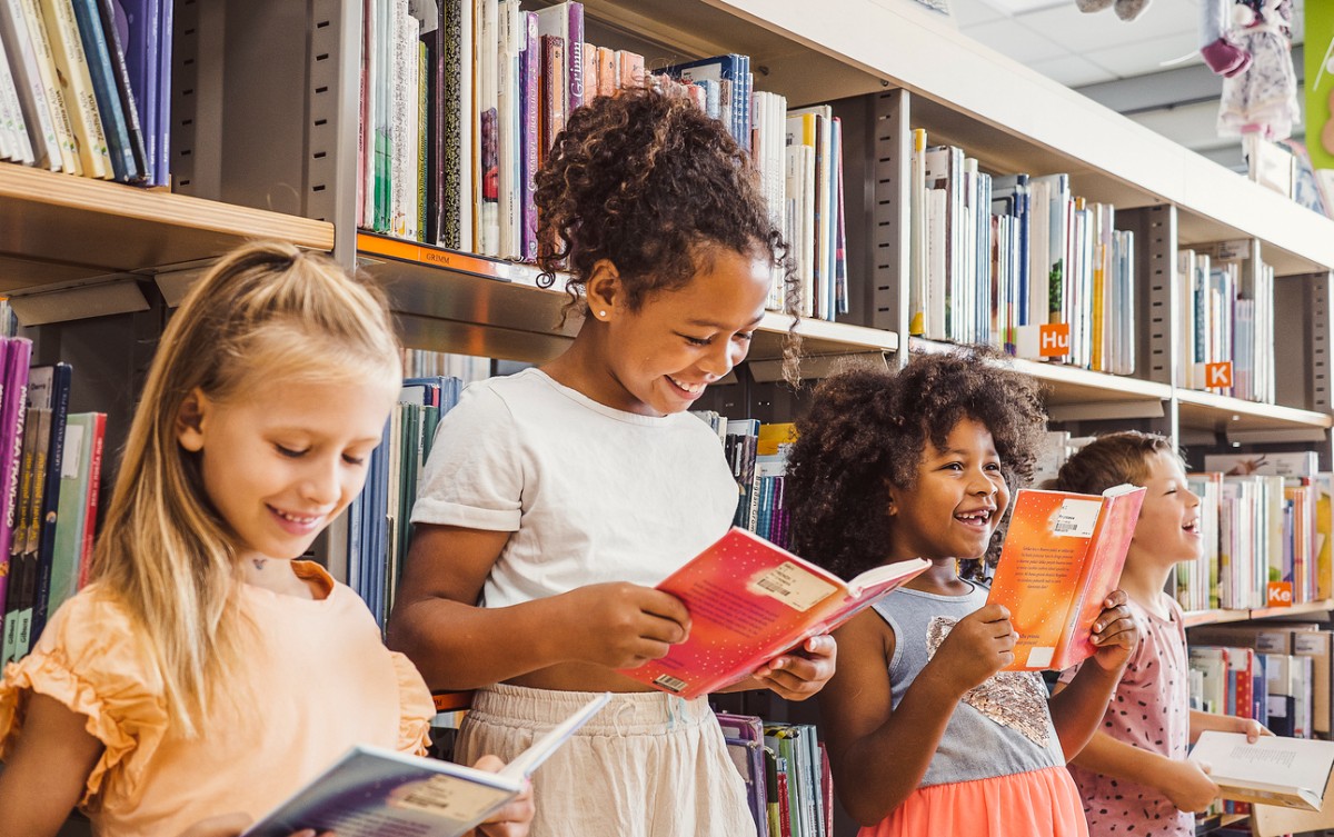 girls happily reading